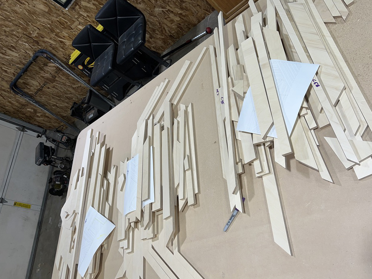 A pile of several wooden parts ready for assembly